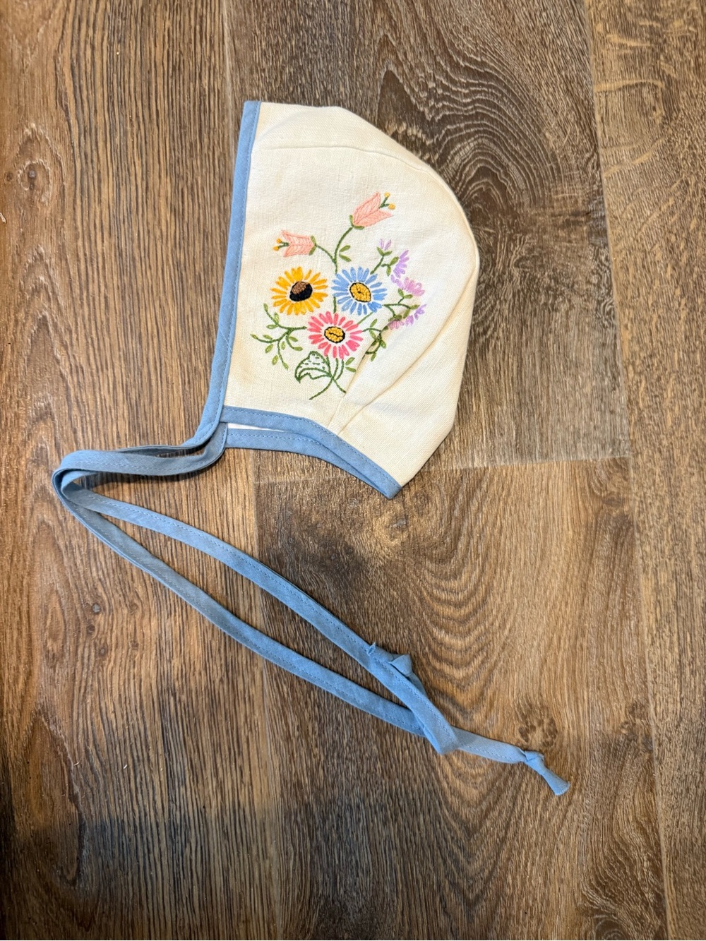 Embroidered Floral Kids Bonnet in Cream with Blue Trim